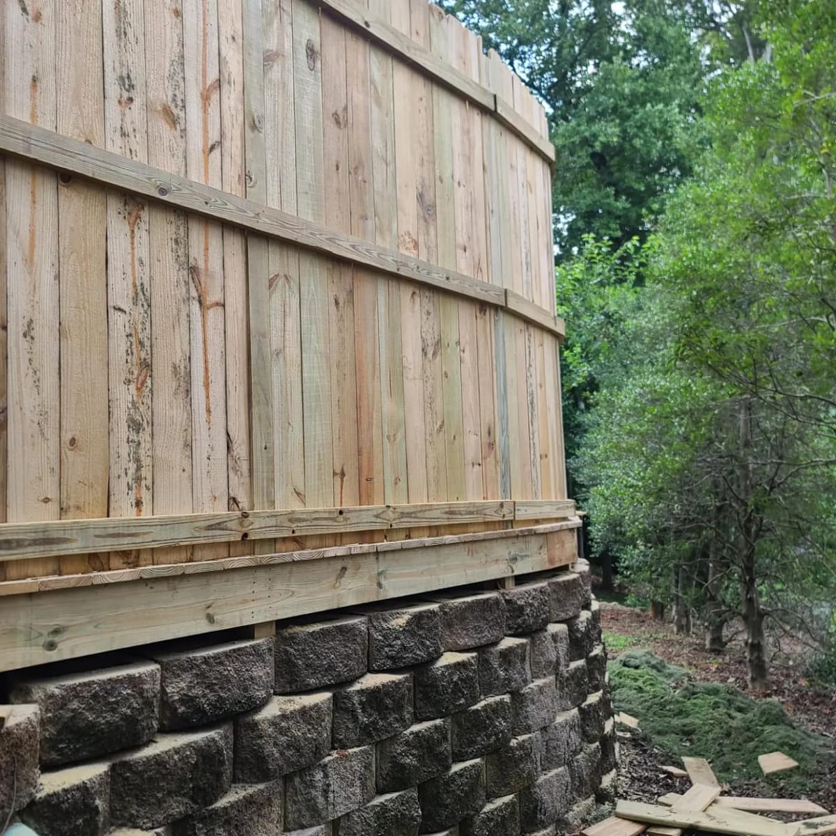Wooden privacy fence sitting on top of the block wall, Atlanta, Georgia