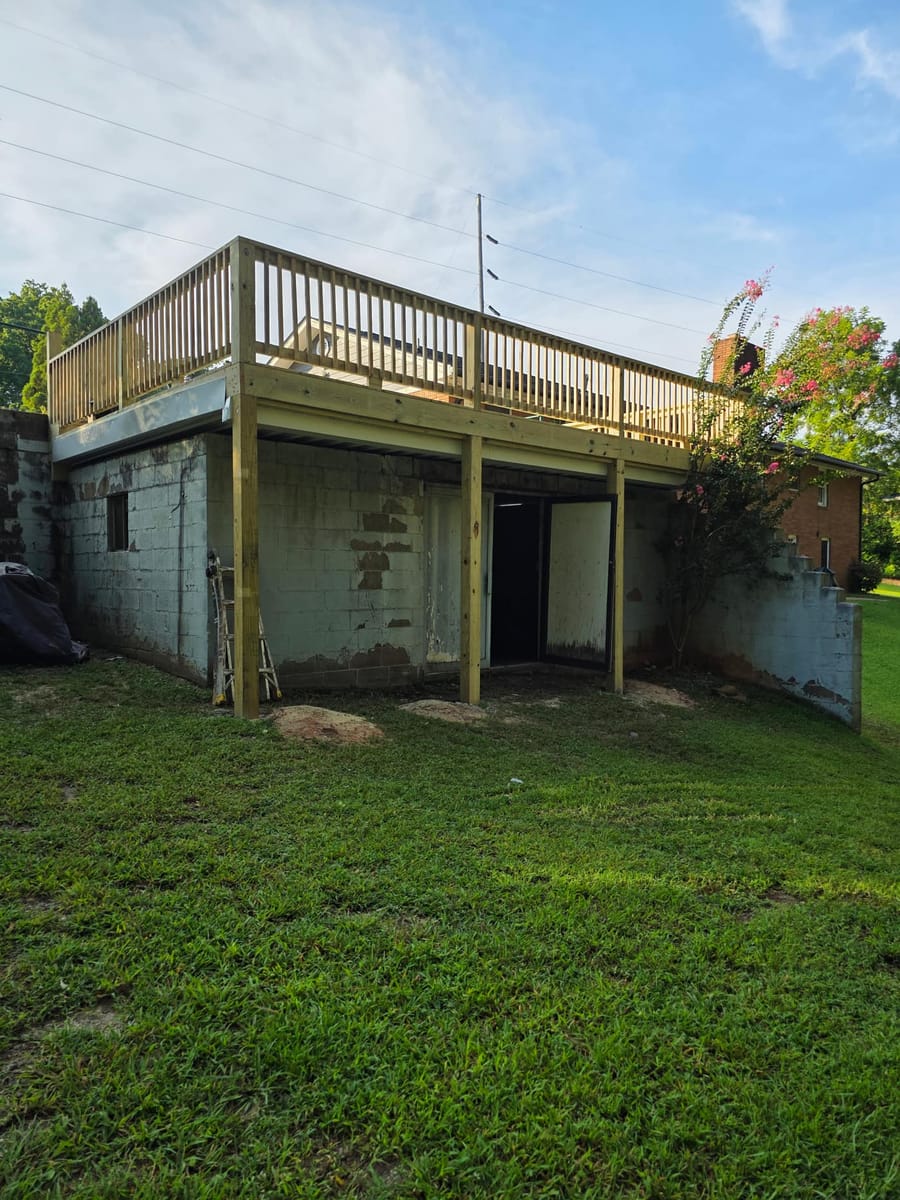 Deck built over existing block walls, with underdecking forming a covered space below, Austell, Georgia