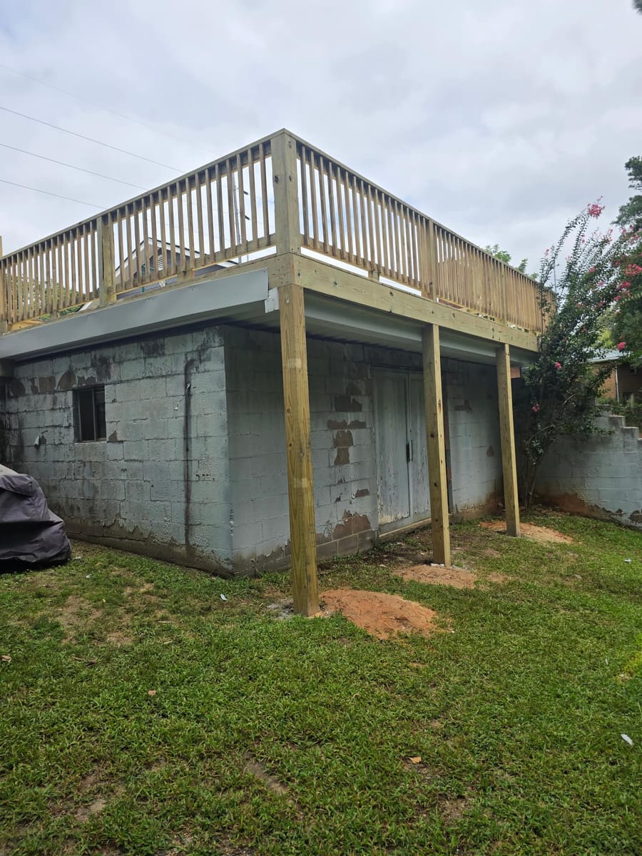 Deck built over existing block walls, with underdecking forming a covered space below, Austell, Georgia