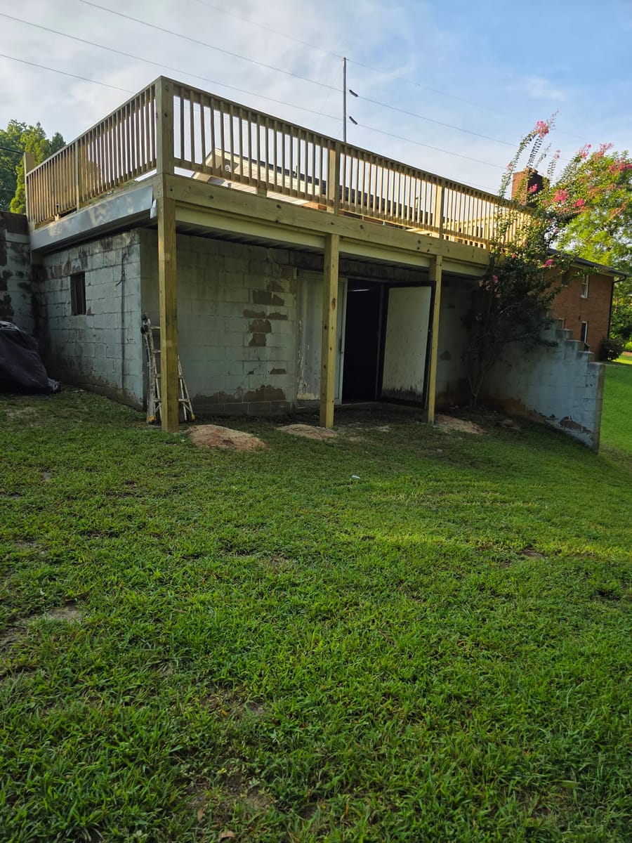 Deck built over existing block walls, with underdecking forming a covered space below, Austell, Georgia