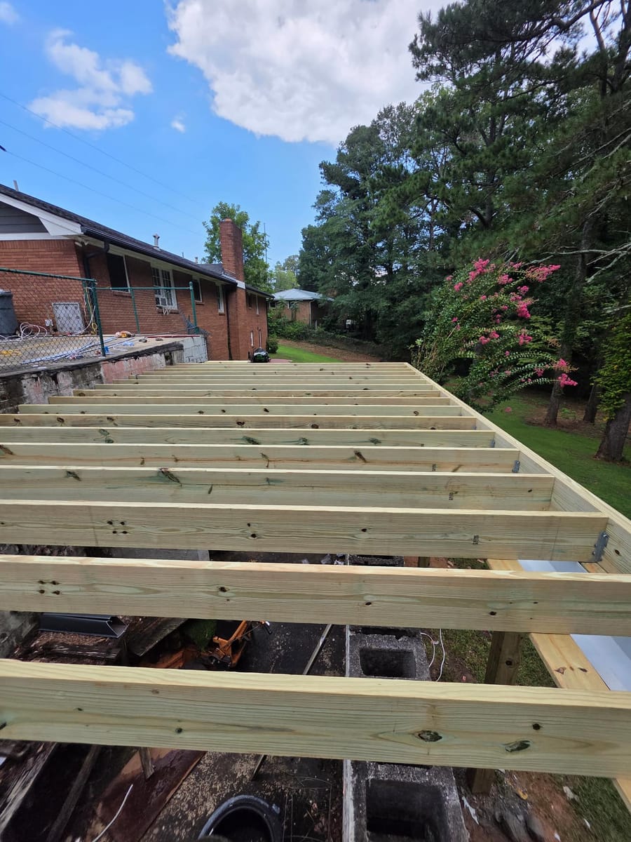 Deck built over existing block walls, with underdecking forming a covered space below, Austell, Georgia