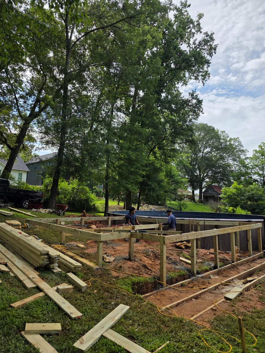 Pool deck framed and boarded around an in-ground pool, with a broad stair run, Ball Ground, Georgia