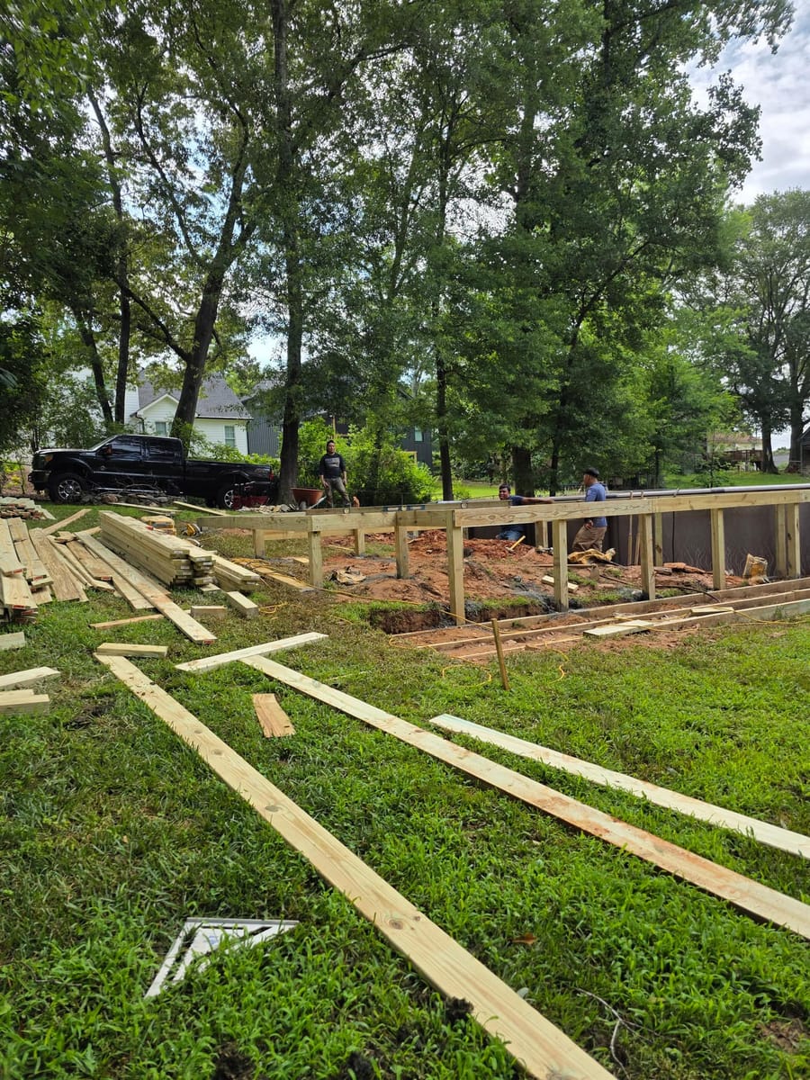 Pool deck framed and boarded around an in-ground pool, with a broad stair run, Ball Ground, Georgia