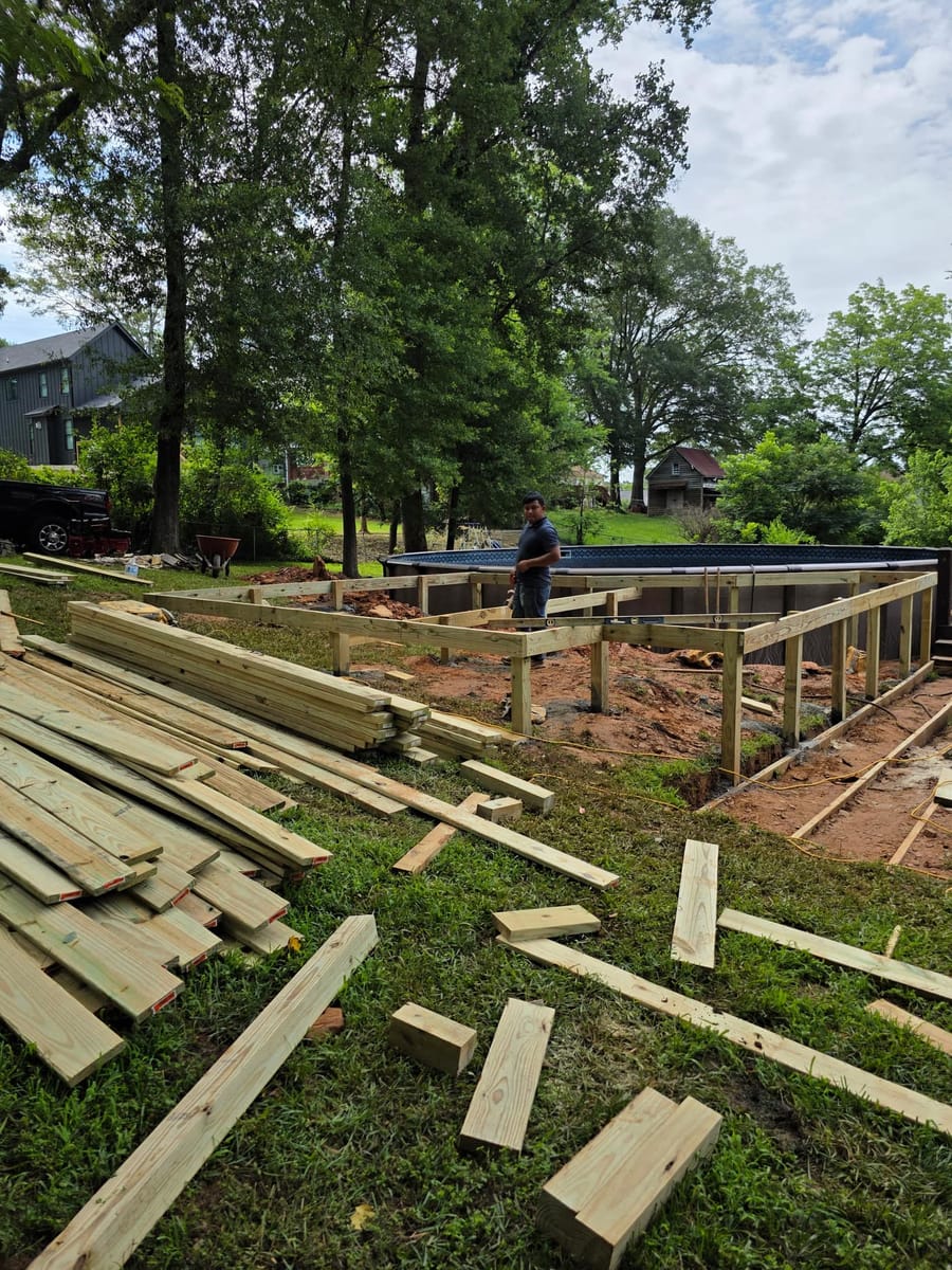 Pool deck framed and boarded around an in-ground pool, with a broad stair run, Ball Ground, Georgia