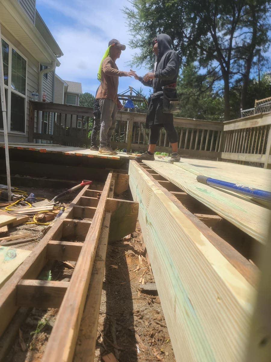 Ground-level deck stripped to the joists and re-decked, existing railings retained, Cumming, Georgia