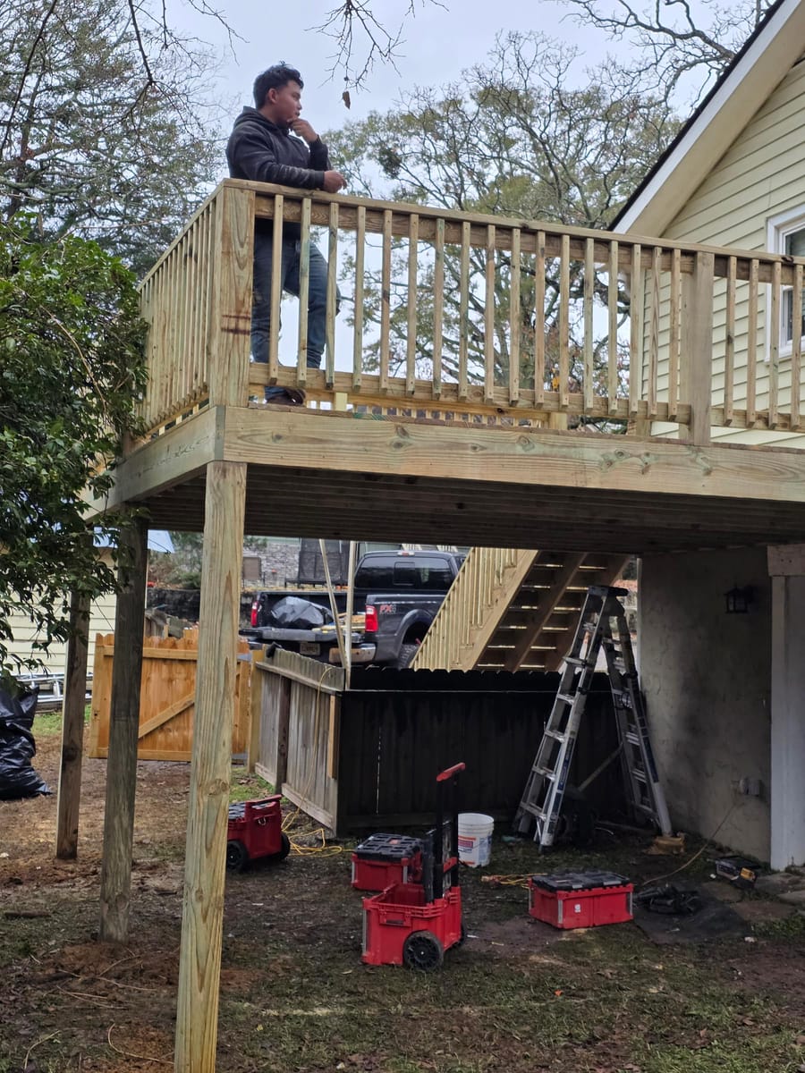 New elevated deck with railings and a long stair run to grade, Dacula, Georgia