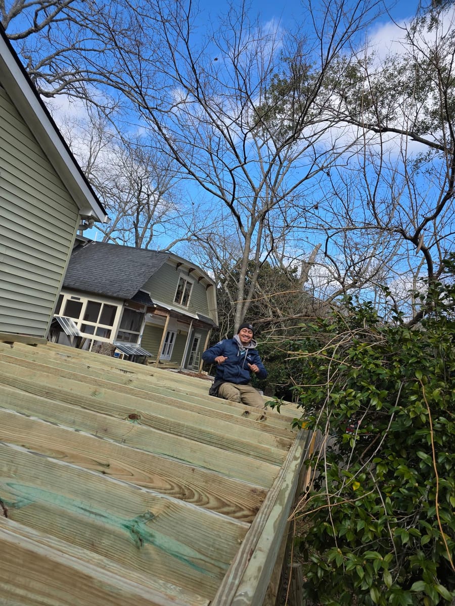 New elevated deck with railings and a long stair run to grade, Dacula, Georgia