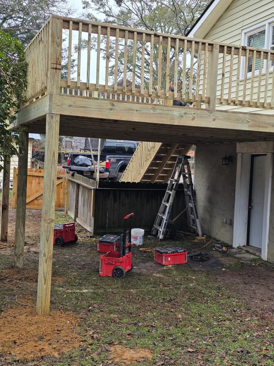 New elevated deck with railings and a long stair run to grade, Dacula, Georgia