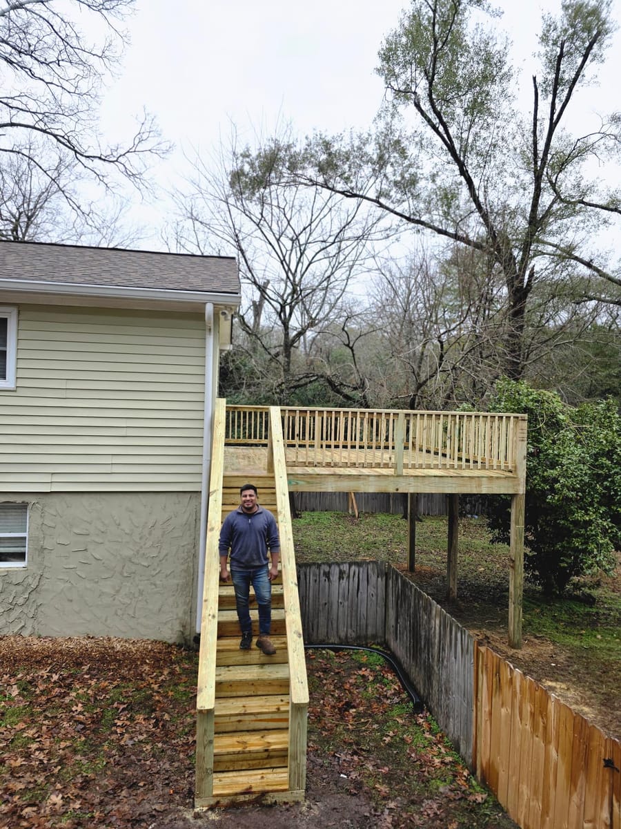 New elevated deck with railings and a long stair run to grade, Dacula, Georgia