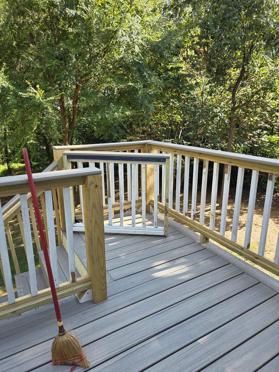 Weathered boards replaced with gray Trex composite decking on the existing frame beneath a covered deck, Kingston, Georgia