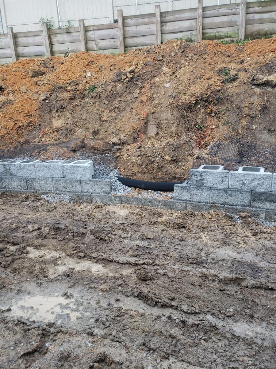 Segmental concrete block retaining wall with drainage, built into a cut slope, Marietta, Georgia