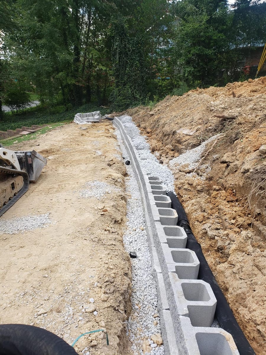 Segmental concrete block retaining wall with drainage, built into a cut slope, Marietta, Georgia
