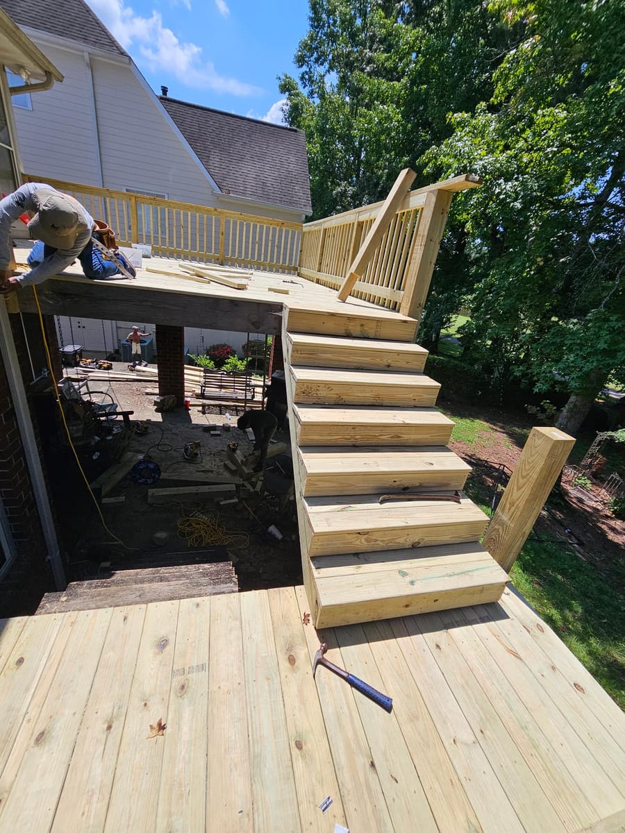 Deck re-boarded and stairs rebuilt on a brick home, existing lattice skirting retained, South Fulton, Georgia
