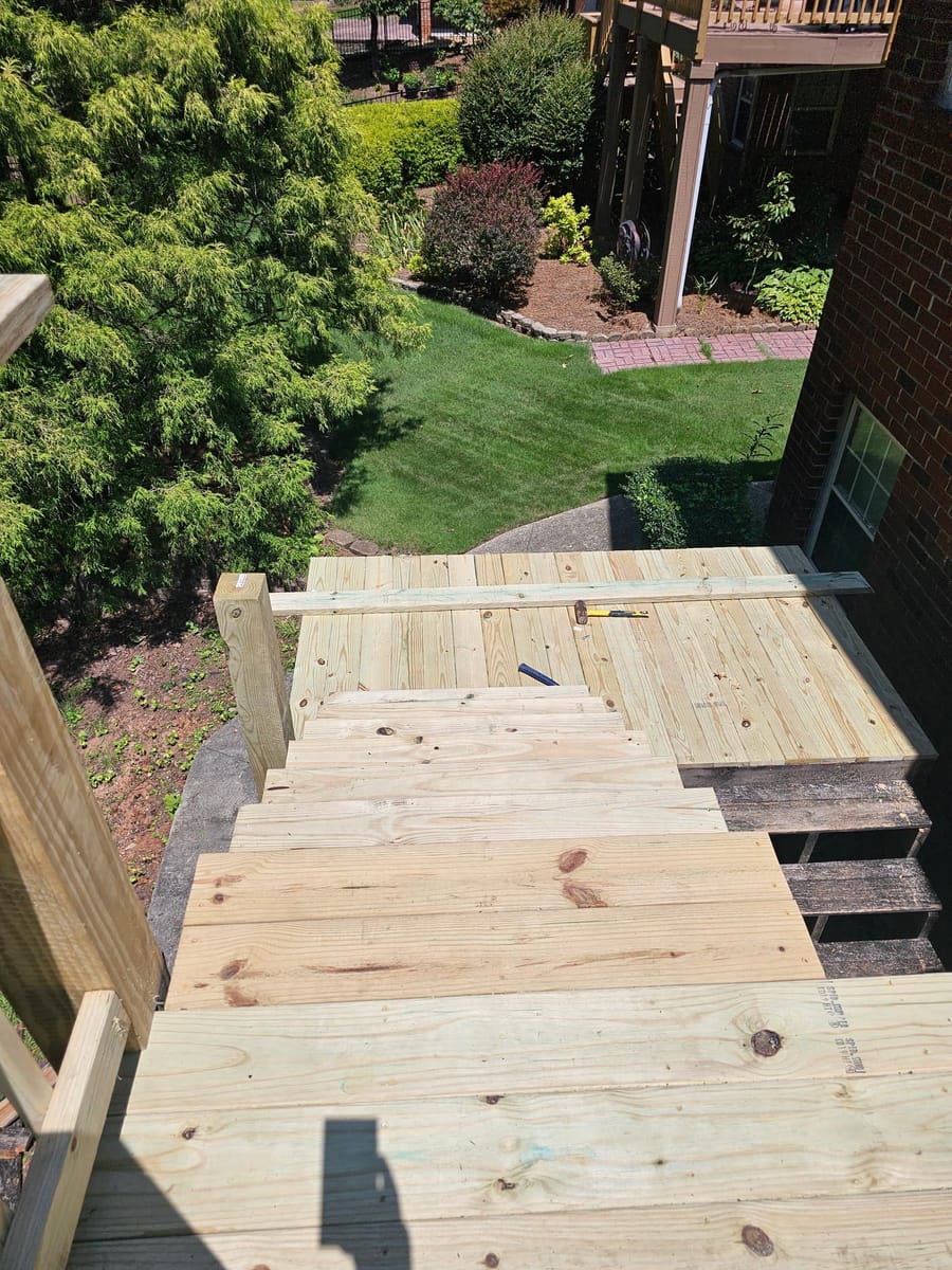 Deck re-boarded and stairs rebuilt on a brick home, existing lattice skirting retained, South Fulton, Georgia