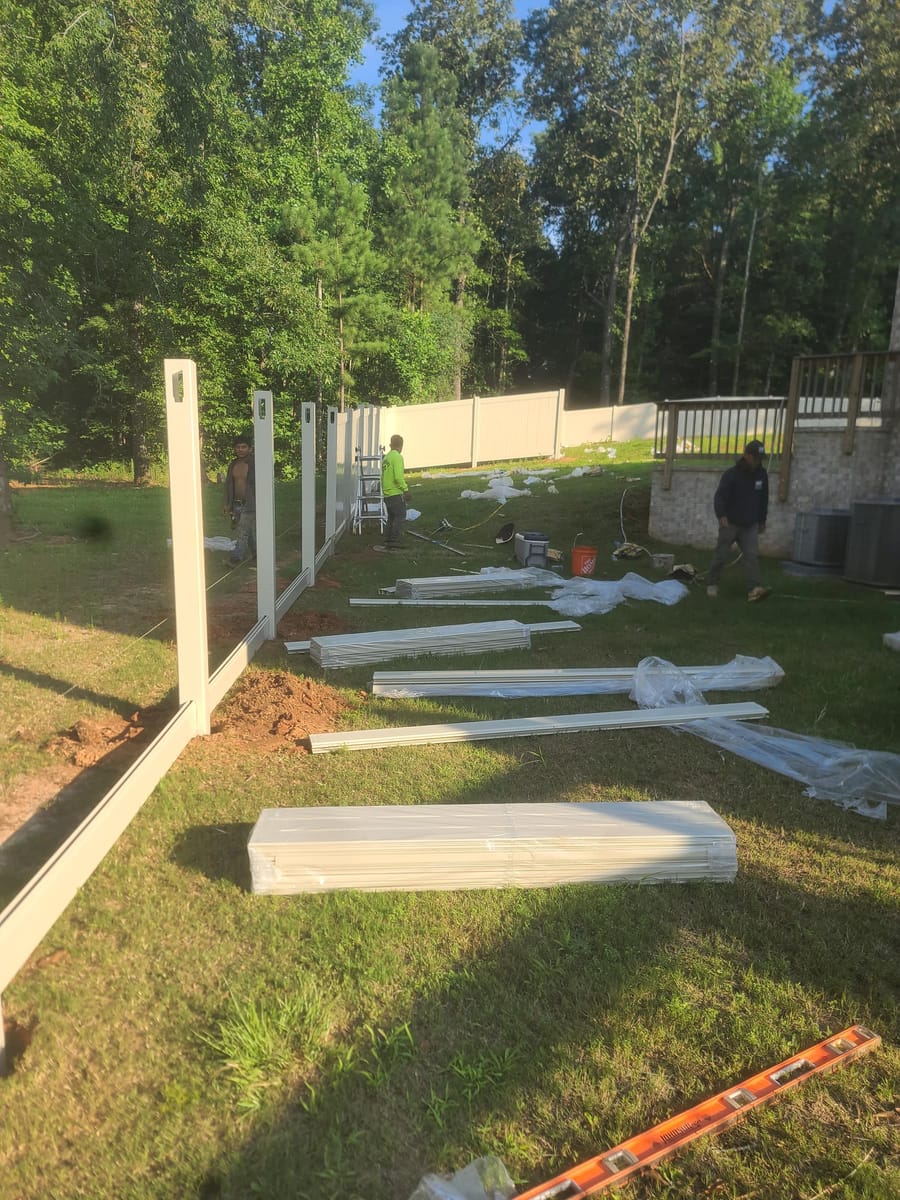 Panels and posts laid out along the line before assembly, Stockbridge, Georgia